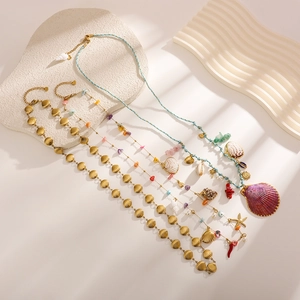 Ocean-themed stainless steel waist chain with shells, pearls, and colorful natural stones