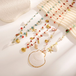Bohemian body chain with natural stones, colorful beads, and golden shell pendants