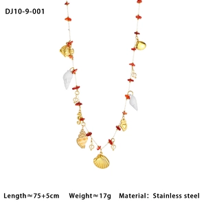 Detailed macro view of marine charms and red beads on a 75cm stainless steel body chain
