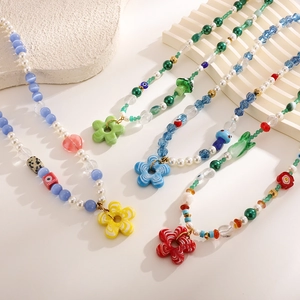 Bohemian beaded necklaces with resin flower pendants in colorful summer styles