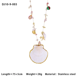 Detail of colorful stone waist chain with white seashell pendant and golden starfish charms