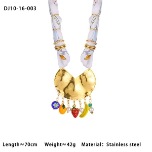 Macro view of stainless steel silk scarf necklace with colorful fruit and moon charms