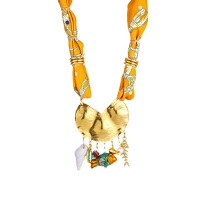 Nautical orange silk scarf necklace with golden fish and shell charms in a vacation style