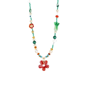 Colorful handmade beaded necklace with a red flower pendant and various glass charms
