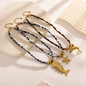 Ocean-themed stainless steel shark and starfish necklace with leopard print cotton cord
