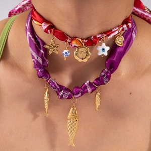 Bohemian silk choker set with starfish, sun face charms and golden fish pendants