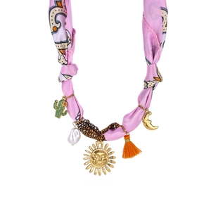 Detail of silk scarf necklace with cactus sun charms and orange fringe pendant
