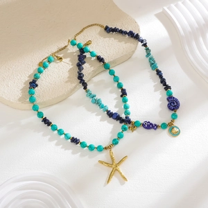 Detail of beaded sea theme necklaces with turquoise, lapis, and golden starfish pendants