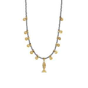 Detail of beaded necklace featuring dark grey beads and a golden fish pendant