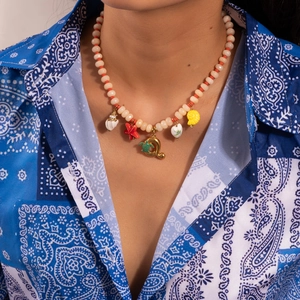 Beaded ocean theme necklace with colorful sea star, shell, and turtle charms for beach style