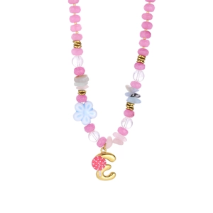 Detail view of a pink beaded necklace featuring a gold letter E pendant and floral beads