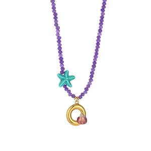 Detail view of purple beaded ocean necklace with starfish charm and seashell pendant