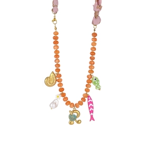 Detail of beaded ocean necklace with orange beads, starfish pendants and floral fabric