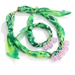 Green paisley fabric jewelry set with pink shell pendants and lobster clasp