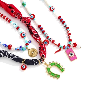 Bohemian Evil Eye necklace with silk scarf and horseshoe pendant in stainless steel