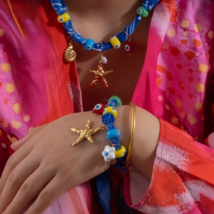 Bohemian jewelry set with sea shells starfish evil eye beads and blue woven silk scarf cord