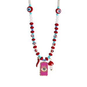 Detailed shot of evil eye beads with red chili and mushroom charms on a steel necklace