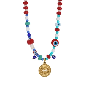 Close-up of beaded evil eye necklace with gold sunburst pendant and mushroom charm