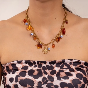 Bohemian gold chain necklace with sun pendant, leopard beads and amber charms