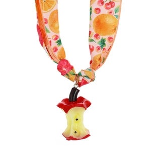 Detail of creative apple core resin pendant with colorful fruit print silk ribbon tie