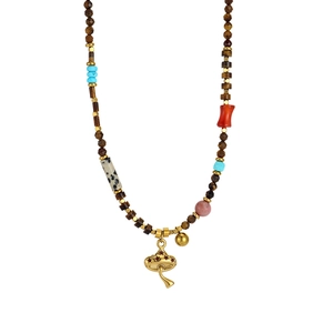 Bohemian beaded necklace featuring natural gemstones with gold mushroom and bell charms