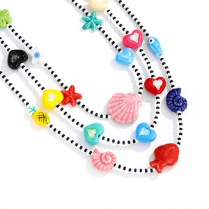 Collier en perles style dopamine avec breloques cœur et étoile de mer pour femme