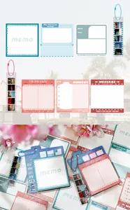 Detail van memoblokken en bladwijzers met filmthema voor creatieve dagboekplanning