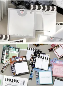 Detailopname van vintage film memo-blaadjes met filmklapper en filmrol ontwerpen