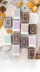 Close-up of vintage floral wooden stamps with intricate rose and lily designs