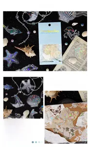 Dettaglio di 45 adesivi marini olografici con delfini e conchiglie per scrapbooking
