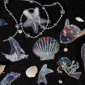 Adesivi olografici creature marine con finitura glitterata e motivi a conchiglia