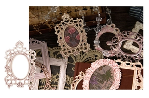 Detail of vintage embossed frame stickers with intricate cutout patterns for scrapbooking