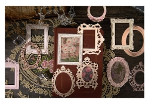 Baroque relief collage frames with vintage lace and dried flowers on dark wood table