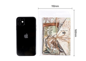 Detailed view of vintage PET stickers set next to a phone for size reference
