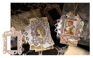 Close-up of vintage baroque style embossed frame stickers for junk journal collage