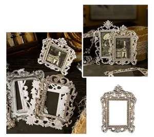 Detail of vintage Baroque relief photo frames with ornate floral resin patterns