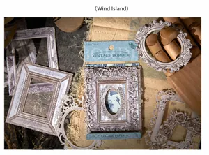Macro detail of vintage embossed paper frames for DIY journaling on rustic burlap background