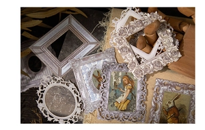 Macro detail of vintage resin photo frames with rose relief and golden brush finish