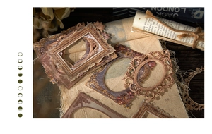 Detailed macro of vintage Baroque style embossed paper frame stickers for journaling