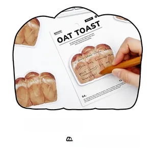 Detail of oat toast shaped sticky note with smooth writing surface on backing card