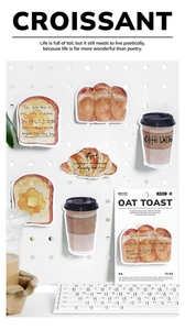 Detailed view of hand-drawn coffee and bread theme stickers on a white pegboard