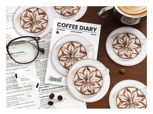 Macro shot of 30pcs coffee art coasters with vintage desk decor and beans
