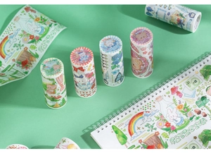 Dettaglio di rotoli di nastro washi cartoon con accenti dorati per scrapbooking
