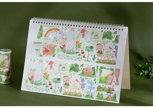 Dettaglio di nastro washi con decorazioni in oro e illustrazioni di conigli e funghi