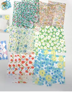Detail of 6 floral scrapbooking paper styles including tulips and daisies for journaling