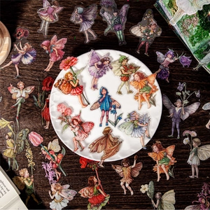 Adesivi decorativi vintage PET con fate dei fiori su tavolo di legno scuro