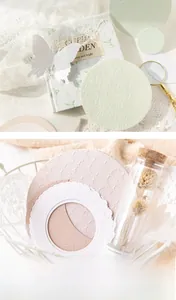 Detail of embossed vintage paper scrapbooking kit with soft pastel tones and textures