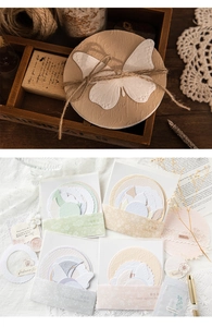 Detail of vintage embossed butterfly scrapbooking cards in four Morandi color palettes