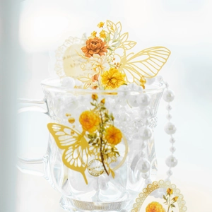 Elegant yellow floral and butterfly PET stickers in a decorative vintage glass with pearls