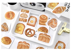 Close-up of realistic bread theme stickers with croissants and baguettes for journaling